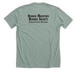 Be Kind... of Feral, a Heather Sage Premium Unisex Tee (back-view)